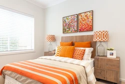 Orange bed in the bedroom interior