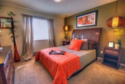 Orange bed in the bedroom interior