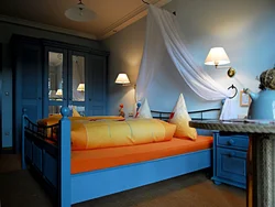 Orange bed in the bedroom interior