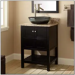 Black cabinet in the bathroom interior