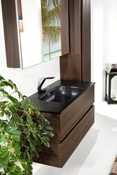 Black cabinet in the bathroom interior