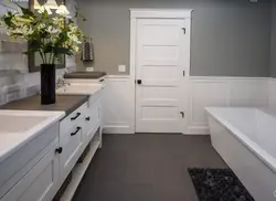 White door in the bathroom interior