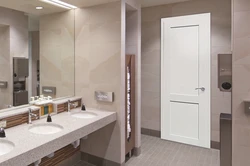 White door in the bathroom interior
