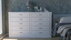 Gray chest of drawers in the bedroom interior