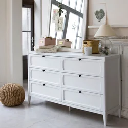Gray chest of drawers in the bedroom interior