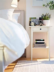 White nightstands in the bedroom interior