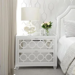 White nightstands in the bedroom interior