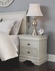 White nightstands in the bedroom interior