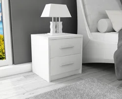 White nightstands in the bedroom interior
