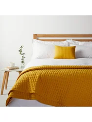 Mustard bed in the bedroom interior
