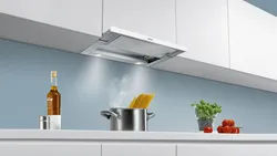 Flat hood in the kitchen interior