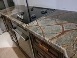 Giallo marble countertop in the kitchen interior