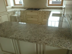 Giallo marble countertop in the kitchen interior