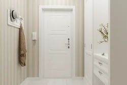 White entrance door in the hallway interior