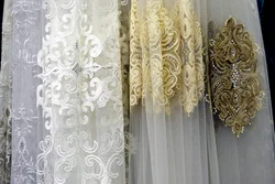 Tulle with embroidery in the living room interior