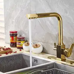 Бронзовый смеситель для кухни в интерьере