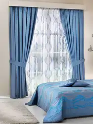 Gray-blue curtains in the bedroom interior