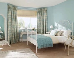 Gray-blue curtains in the bedroom interior