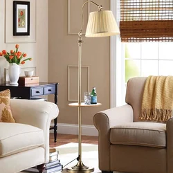 Armchair with floor lamp in the bedroom interior