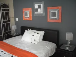 Gray and orange in the bedroom interior