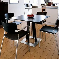 Square table in the kitchen in the interior