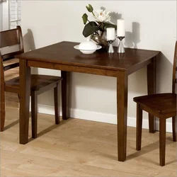 Square table in the kitchen in the interior