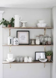 White shelves in the kitchen interior