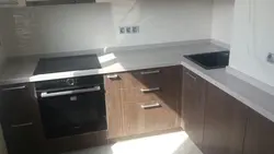 Semolina beige countertop in the kitchen interior