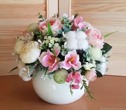 Vase with flowers in the kitchen interior