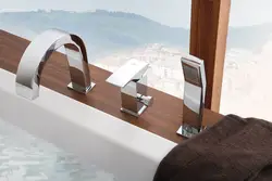 Faucet on board the bathtub in the interior