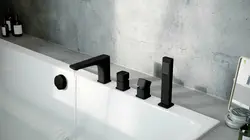 Faucet on board the bathtub in the interior