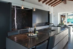 Black marble countertop in the kitchen interior