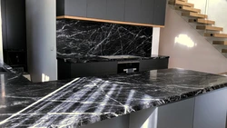 Black marble countertop in the kitchen interior