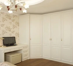 White corner wardrobe in the bedroom interior