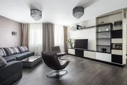 Living room with a wall in the interior and a sofa