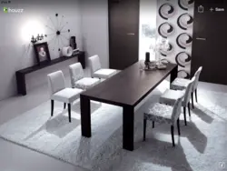 Table with black legs in the kitchen interior