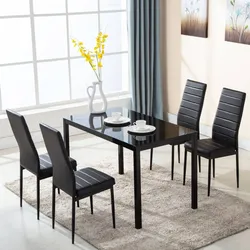 Table with black legs in the kitchen interior