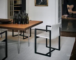 Table with black legs in the kitchen interior