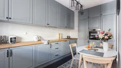 Gray kitchen with black handles in the interior