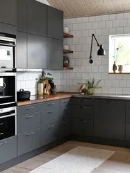 Gray Kitchen With Black Handles In The Interior
