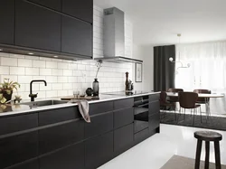 Gray kitchen with black handles in the interior