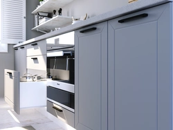 Gray kitchen with black handles in the interior