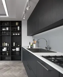 Gray kitchen with black handles in the interior