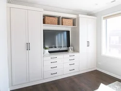 Wardrobe and chest of drawers in the living room in the interior