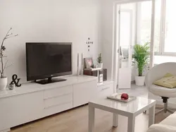 White TV stand in the living room interior