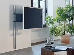 TV on a bracket in the interior of the living room
