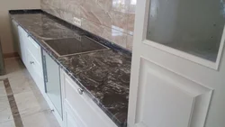 Black Marquina marble countertop in the kitchen interior