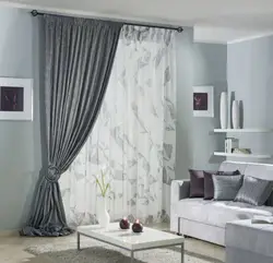 Marble curtains in the interior with tulle in the living room