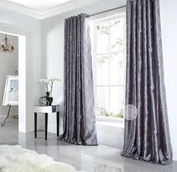 Marble curtains in the interior with tulle in the living room
