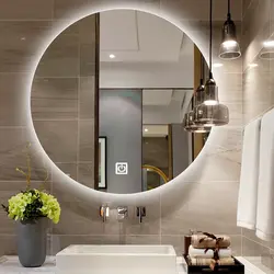 Round Mirror With Lighting In The Bathroom In The Interior